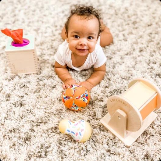 Baby with wooden toys