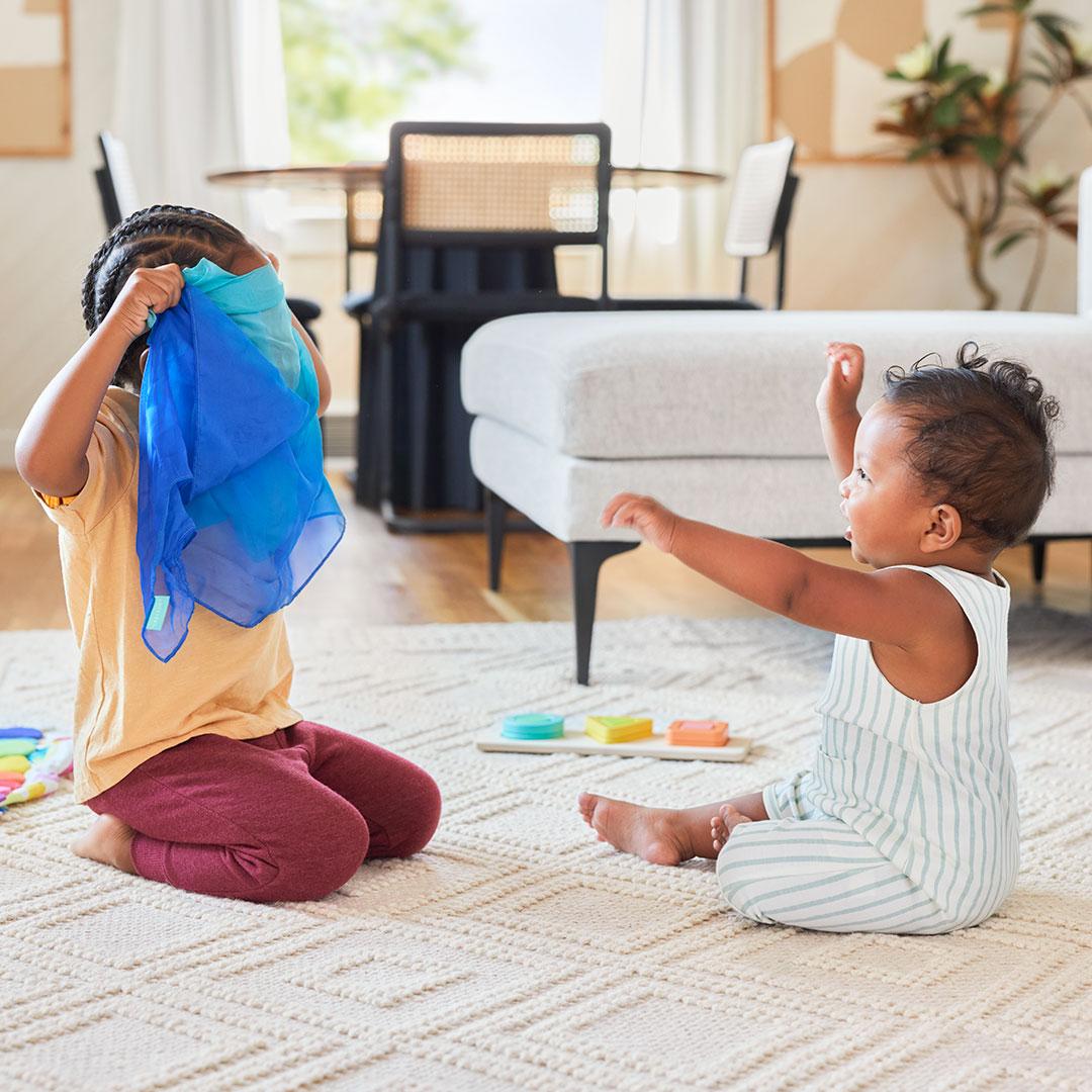 siblings playing with toys