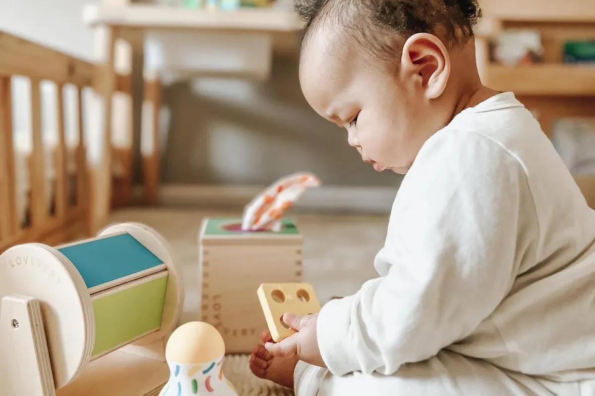 baby with sensory toys