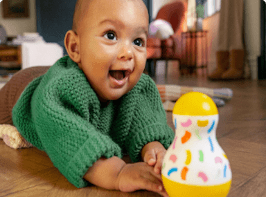 baby with tummy time wobbler